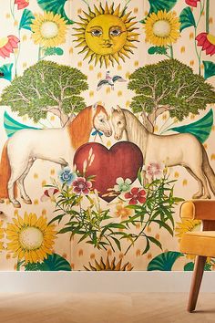 the wallpaper in this room has horses and sunflowers on it, as well as an apple