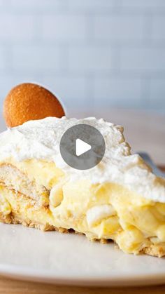 a piece of cake sitting on top of a white plate with an orange in the background