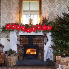 a living room decorated for christmas with presents and decorations on the fireplace mantels