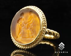 Marcus Aurelius Roman Signet Glass Intaglio Coin 24K Gold Plated 925 Silver Ancient Ring Handmade Jewelery Ring Historical Art Design Ring 💍Item Details💍 SKU CODE: GIMM23044O ★ Material: 24K Gold Plated 925 Sterling Silver ★ Silver Weight: App. 5,25 Grams {6 USA Size] ★ Ring Diameter: 2.3 mm ★ Ring Size: Available in variations  ★ Coin: Marcus Aurelius ★ Coin Size: 22,30X20,50 mm (With Border) ★ Coin Metarial: Orange Glass  ★ Ring Plate: Available in variations to Rose Gold & 24K Gold & Black Gold Cabochon Signet Ring For Wedding, Heirloom Carved Gold Rings, Heirloom Style Carved Gold Rings, Gold Engraved Intaglio Ring For Formal Occasions, Heirloom Gold Engraved Ring With Intaglio, Gold Oval Rings With Intaglio Detail, Heirloom Carved Gold Signet Ring, Gold Carved Signet Ring For Ceremonial Occasions, Oval Gold Rings With Intaglio Detail