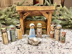 a nativity scene with figurines in the foreground