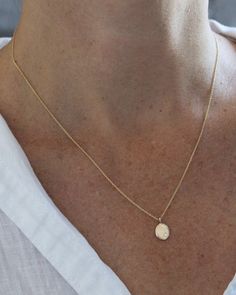 The sweetest, classic silhouette. This little recycled 14k gold droplet measures just about 3/8" by 1/4", and is accented with a tiny white diamond and hangs on a delicate cable chain. Available in 16", 18" or 20". Availability: Currently in stock and ready to ship. Minimalist Yellow Gold Teardrop Pendant Charm Necklace, Dainty Yellow Gold Drop Necklace For Everyday, Delicate Yellow Gold Drop Necklace For Everyday, Minimalist Yellow Gold Round Pendant Drop Necklace, Minimalist Oval Charm Necklace With Delicate Chain, Minimalist Oval Charm Necklaces With Delicate Chain, Droplet Necklace, Glassine Envelopes, Dainty Gold Necklace