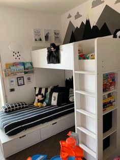 a child's bedroom with bunk beds and toys