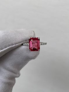 Vintage Pink Tourmaline Ring, Emerald Cut Tourmaline Ring, 925 Sterling Silver, Pavé Ring, Wedding Ring, Engagement Ring, Gift for her  Handmade ring. Stone : Lab Pink Tourmaline  Gemstone Cut : Emerald Cut Stone Size : 9mm×7mm Side Stone : Cubic Zirconia Metal  : 925 Sterling Silver Plating:  Platinum Plated , Rose Gold Plated , Gold Plated. Personalization:10K/14K/24K/GOLD/SILVER/PLATINUM/ROSE-GOLD/WHITE GOLD. (Contact me)  All items come in a beautiful jewelry box.  Since all out Jewelry is H Tourmaline White Gold Jewelry With Prong Setting, White Gold Tourmaline Jewelry With Prong Setting, White Gold Tourmaline Ring With Prong Setting, Fine Jewelry White Gold Tourmaline Rings, Silver Emerald Cut Tourmaline Ring, White Gold Tourmaline Ring With Accent Stones, Emerald Cut Pink Sapphire Ring With Center Stone, Pink Emerald Cut Ruby Ring In Fine Jewelry, Emerald Cut Pink Ruby Ring In Fine Jewelry Style