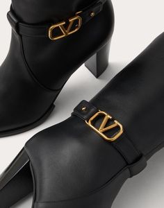 Valentino Garavani calfskin boot with VLogo Signature decoration - Strap with personalised VLogo Signature buckle in an antique-effect brass finish - Internal side zip - Leather-covered block heel - Heel height: 75 mm / 3 in. - Shaft height: 38 cm / 15 in. in an Italian size 37 - Made in Italy Gold Leather Ankle Heeled Boots, Gold Ankle Leather Heeled Boots, Luxury High Heel Boots With Buckle Closure, Elegant Gold Boots With Leather Sole, Luxury Gold Boots, Formal Gold Calf Leather Boots, Gold Luxury Calf Leather Boots, Luxury Gold Leather Heeled Boots, Luxury Gold Calf Leather Boots