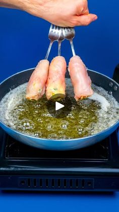 someone is frying some food in a pan on the stove