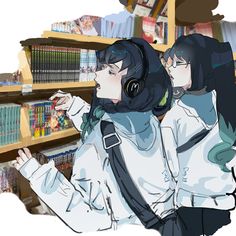 two girls are standing in front of bookshelves