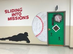 a baseball themed classroom door with the words sliding into missions painted on it's side