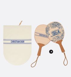 two ping pong paddles and an oven mitt are shown in this image