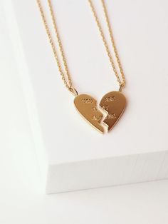 Set includes 2 half heart-shaped necklaces stamped with YOU ARE NOT ALONE The necklace chains are 16" shiny gold or silver chain with 2" extenders finished with a lobster clasp closure This item is not available to be customized Heart-shaped Gold Necklace For Best Friend, Gold Heart Necklace For Promise, Heart-shaped Gold Necklace For Promise, Personalized Double Heart Necklaces For Friendship, Personalized Double Heart Friendship Necklace, Gold Heart Charm Necklaces For Friendship, Gold Charm Necklaces For Valentine's Day And Friendship, Personalized Heart Pendant Necklace For Promise, Gold Heart Charm Necklace As Gift