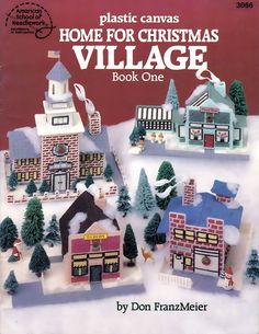 the front cover of plastic canvass home for christmas village book one, featuring houses and trees