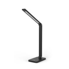 a black desk lamp on a white surface with the light turned on and dimming