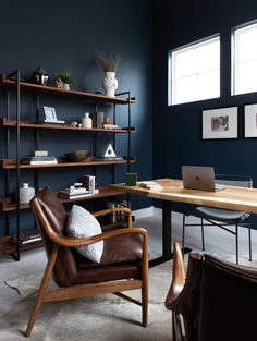 a living room filled with furniture and a book shelf