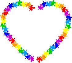 a heart made out of puzzle pieces with the colors of the rainbow in it's center