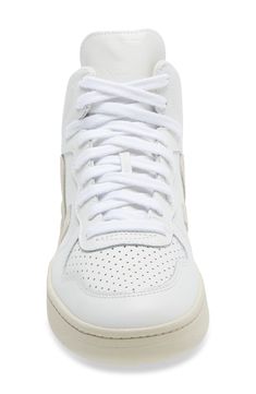 Perforated details and a cushioned footbed offer sporty style and comfort in this eco-friendly leather sneaker made to make a difference. Removable insole Leather upper/textile lining/rubber sole Made in Brazil Top Sneakers Women, Mid Top Sneakers, Mid Top, Made In Brazil, Make A Difference, Sporty Style, Emphasis, A Logo, Up Styles