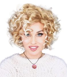 Angelina Wig by WigPro | Synthetic Wig has voluminous loose curls making this a wearable contemporary classic. Short Locks, Synthetic Hair Care, Dramatic Necklace, Good Quality Wigs, Tempura Batter, Big Curls, Curly Hair Extensions, Short Curly Wigs, Alternative Hair