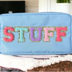 Elevate your travel game with our Chenille Letter Nylon Bag. Perfect for makeup, snacks, or as a travel pouch, it's a statement piece adorned with varsity patches and a gold zipper. At a generous 12 x 6 x 3.5 inches, there's plenty of space for all your essentials. Show off your unique style in nostalgic southern fashion. Choose Blue or Pink Varsity Patches, Southern Fashion, Blue Or Pink, Travel Games, Children's Boutique, Travel Pouch, Nylon Bag, Gold Zipper, Blue Bags