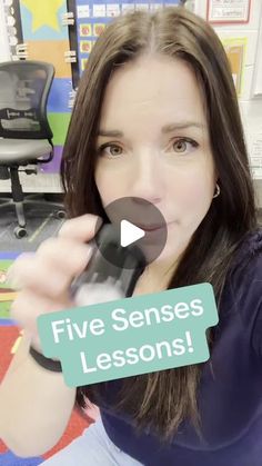 a woman holding a cell phone up to her face with the caption five sense lessons