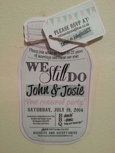 we still do john and josie wedding party sign hanging from the side of a wall