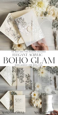 the elegant acrylic boho glam wedding stationery is displayed with flowers and greenery