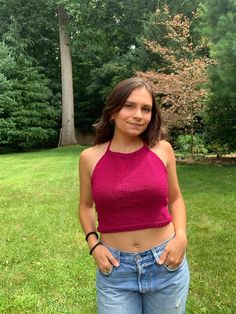 "This cute magenta summer halter top is a great pop of color to add to your summer wardrobe! Can easily be layered for the cooler months too. This top is knit with 1x1 rib stitch for the bottom band and top collar, the body is knit with stockinette stitch. The back lace-up feature allows for complete adjustability, as well as, adorable detailing. The neckline also has tie straps for adjustability there! You simply cannot go wrong with this top!  Measurements: Top Straps Length = 15' Torso straps Summer Beach Knit Tank Top, Beach Stretch Knit Top, Pink Knit Top For Summer Day Out, Stretch Halter Neck Summer Top, Stretch Summer Halter Neck Top, Stretch Knit Tops For Vacation, Summer Stretch Halter Neck Top, Vacation Tops With Knit Fabrication And Stretch, Vacation Stretch Knit Tops