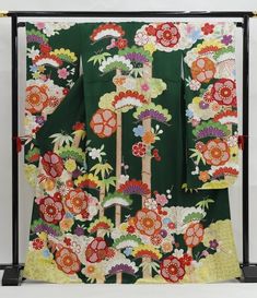 Cover yourself in a garden of flowers wearing this traditional Japanese silk Furisode kimono in teal green.   Made of high quality silk threads.  Beautiful to wear or as a room display. Item: Furisode Silk Kimono No. frn301 Size: US  L /  Length  66 inch (168cm), Width 26.9 inch (68.5cm) Design :  Floral  Condition: Used, Very Good. Please check the photos. Need a KIMONO RACK to hang this kimono?  Find it here: https://www.etsy.com/listing/1303669853/kimono-rack-japanese-kimono-display-rack Shop Kimono Display, Furisode Kimono, Green Kimono, Kimono Floral, Wedding Kimono, Japanese Dress, Room Display, Japanese Silk, Kimono Sleeves