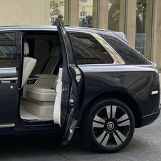 a black and white car with its door open