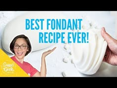 a woman holding up a large white object with the words best fondant recipe ever