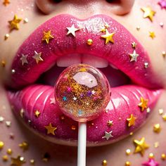 a close up of a person's lips with glitter on them and a lollipop