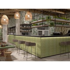 an image of a restaurant setting with bar seating and plants on the wall behind it