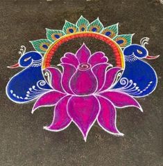 a colorful flower and two birds drawn on the ground with chalk pastel pencils