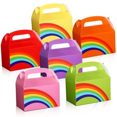 six brightly colored boxes with handles on each side and rainbow designs on the sides, all in different colors