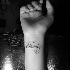 a woman's arm with a tattoo that says family on it and an anchor