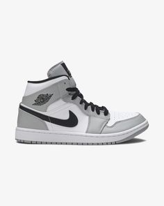 The pairs don a smooth white leather base with light grey overlays. Anthracite hues are found on the raised ankle collar, tongue, liner, and lateral swooshes which offer white contrast stitching. The Air Jordan ball-and-wings logo adorns the laterals and the Jumpman motif rests on the tongue tags and in-sole heels. Bel Jordan Mids, Sneaker Displays, Jordan Mid, Nike X Travis Scott, Jordan Low, All Nike Shoes, Wings Logo, Air Jordan 6, Air Jordan 5