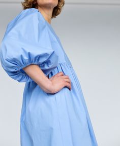 "Puffy sleeve cotton dress in sky blue color. Perfect for any occasion or to wear every day. - Handmade in our studio from 97% cotton 3% spandex - Relaxed fit - Crew neckline - Half-length puffed sleeves - Side slip pockets - Full A-line skirt - Straight, midi hem FABRIC&CARE Cotton Hand wash or gently machine washable 30C, hang dry recommended, iron on reverse. SIZE&FIT Simona is wearing XS size and is 172 cm/5'8\" tall. SIZE XXS *BODY: Bust: fits bust around 32\"-33\"/ 82-84 cm Waist: Light Blue Cotton Mini Dress For Day Out, Summer Blue Midi Dress With Gathered Sleeves, Blue Puff Sleeve Dress For Spring Daywear, Cotton Day Dresses With Gathered Sleeves, Blue Puff Sleeve Dress With Gathered Sleeves For Spring, Cotton Daywear Dress With Gathered Sleeves, Light Blue Long Sleeve Cotton Dress, Blue Cotton Mini Dress With Short Sleeves, Light Blue Cotton Midi Dress With Short Sleeves