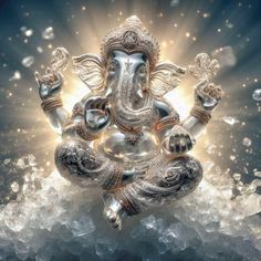 an image of the god ganesha in silver and gold with bubbles around it