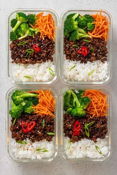 four plastic containers filled with rice, broccoli and carrots on top of each other