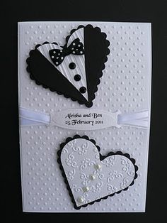 a wedding card with two hearts and a tuxedo on the front, in black and white