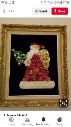 a framed painting with a santa clause holding a christmas tree