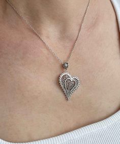 Introducing our Handcrafted Filigree Art Asymmetric Heart Figured Women's Silver Pendant Necklace! This stunning piece features a unique design with an asymmetric heart-shaped pendant, measuring 1.65 inches in height and 1.05 inches in width, suspended from a 20-inch silver chain. Expertly crafted with filigree art, this necklace is a beautiful addition to any jewelry collection. It comes with a silver polish cloth and a luxurious gift box, making it the perfect gift option for Mother's Day, ann Elegant Filigree Heart Necklace, Unique Heart Pendant Wedding Jewelry, Unique Heart Pendant Jewelry For Wedding, Elegant Handmade Heart Pendant Jewelry, Elegant Heart-shaped Large Pendant Jewelry, Elegant Heart-shaped Filigree Necklace, Elegant Heart Shaped Filigree Necklace, Unique Wedding Jewelry With Heart Pendant, Unique Heart Charm Pendant Jewelry