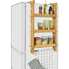 an image of a refrigerator with food on it's shelves and towels hanging from the door