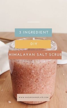 a jar filled with himalayan salt on top of a wooden table