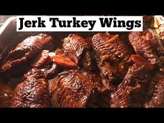 a pan filled with meat covered in gravy next to the words jek turkey wings