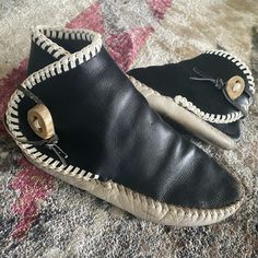 Black Handmade Vintage Moccasins. I Have Added Deer Horn Buttons And Round Braided The Top. Super Cool Retro Mocs. Tons Of Wear Left In Them. Have Been Well Kept And Oiled. Womens Size 7. Black Leather Slippers With Stitched Sole, Black Leather Moccasins With Rubber Sole, Black Moccasins With Leather Sole And Flat Heel, Handmade Black Boots With Round Toe, Traditional Black Boots With Leather Sole, Black Leather Moccasins With Textured Sole, Black Moccasins With Rubber Sole And Round Toe, Black Moccasins With Rubber Sole, Black Slip-on Moccasins With Leather Sole