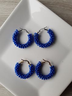 Dark blue beads of 0,12 inches round made on the circle of the silver or gold hoop earrings. The hoop earrings are made of stainless steel, retain the color and has een locked closure. The hoop earrings are 1,18 inches round. These earrings also look great with denim clothing. These earrings add sophistication to your look.  Beautiful earrings for gift for birthday of Christmas.          The jewelry is sent in a box or in a organza bag.     The jewelry will be packages in a bubble wrap that fits Blue Hypoallergenic Hoop Jewelry, Hypoallergenic Blue Hoop Jewelry, Trendy Handmade Round Hoop Earrings, Handmade Blue Round Hoop Earrings, Blue Hypoallergenic Hoop Earrings, Blue Hypoallergenic Small Hoop Earrings, Blue Hypoallergenic Small Hoop Jewelry, Hypoallergenic Blue Small Hoop Jewelry, Nickel-free Small Hoop Metal Beaded Earrings