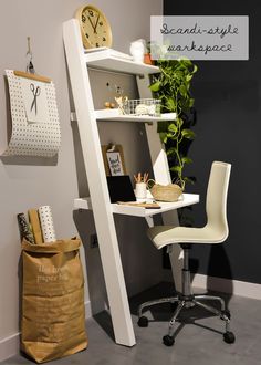 a white desk chair sitting next to a book shelf with a clock on the wall