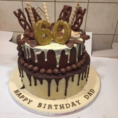 a birthday cake with chocolate and white frosting