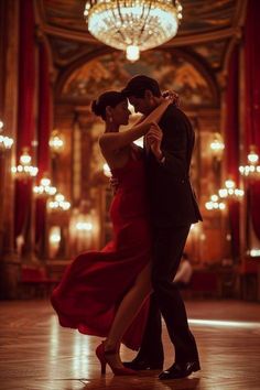 a man and woman dancing in a ballroom