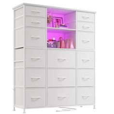 a large white cabinet with many drawers and lights on the top one is lit up