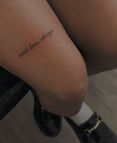 a woman's leg with the words, with love always written on it